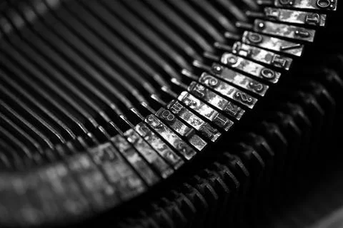 Different small metal elements of an old typewriter Stock Photos