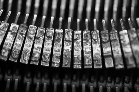 Different small metal elements of an old typewriter Stock Photos