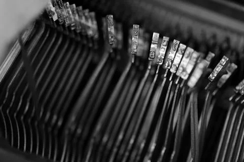 Different small metal elements of an old typewriter Stock Photos