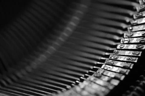 Different small metal elements of an old typewriter Stock Photos