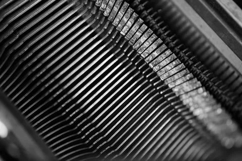 Different small metal elements of an old typewriter Stock Photos