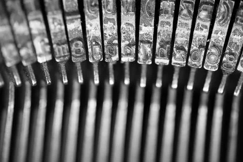 Different small metal elements of an old typewriter Stock Photos