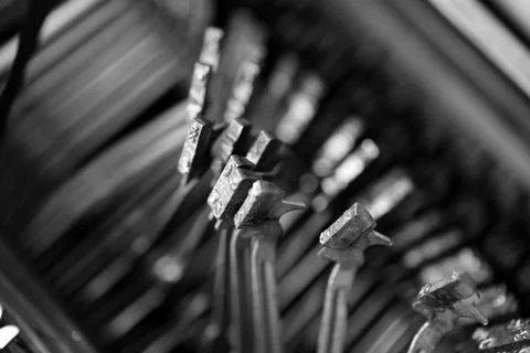 Different small metal elements of an old typewriter Stock Photos