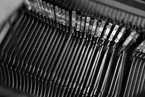 Different small metal elements of an old typewriter Stock Photos