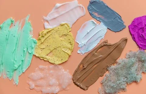 Different smears of cosmetics. Selective focus. Wet. Stock Photos