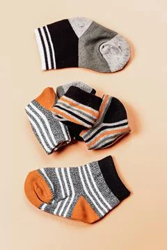 Different socks beige background with copy space. Flat lay. Top view. Stock Photos