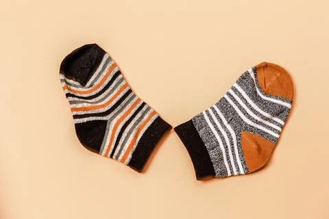 Different socks beige background with copy space. Flat lay. Top view. Stock Photos