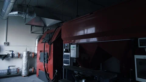 Different solid fuel boilers in room. Energy savings concept Stock Footage 105379658