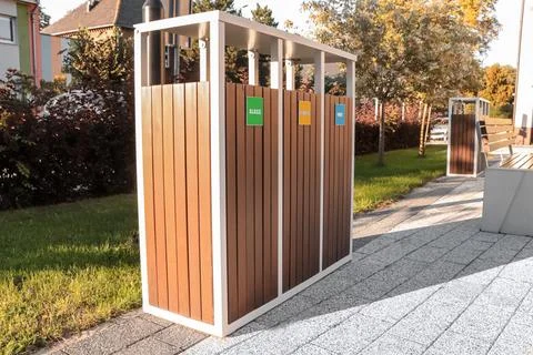 Different sorting bins for waste recycling on sunny day outdoors Stock Photos