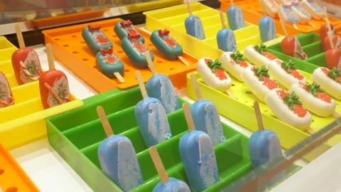 Different sorts of popsicles displayed in confectionary shop Stock Footage 148544498