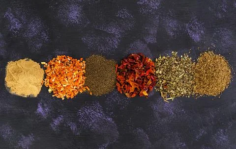 Different spices on dark background. Top view Stock Photos