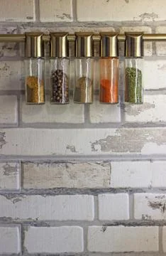 Different spices in the glass jars. Kitchen furniture concept. Stock Photos