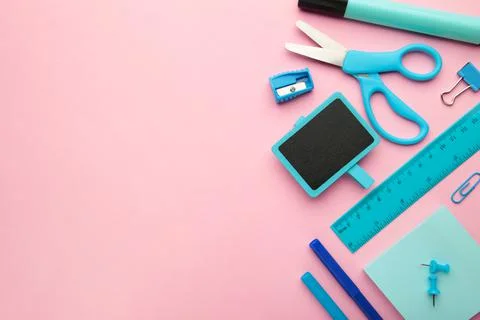 Different stationery on pink background, flat lay with space for text. Stock Photos