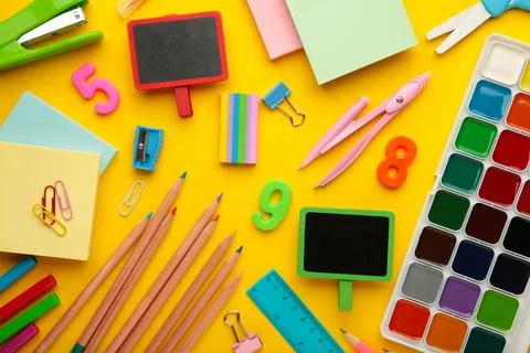 Different stationery on yellow background, flat lay with space for text. Stock Photos