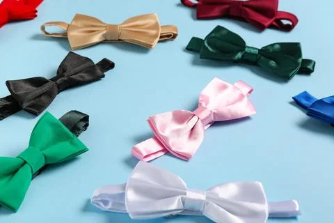 Different stylish bow ties on blue background, closeup Stock Photos