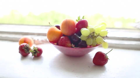 Different Summer fruits on a window sill Stock-Footage 42261607