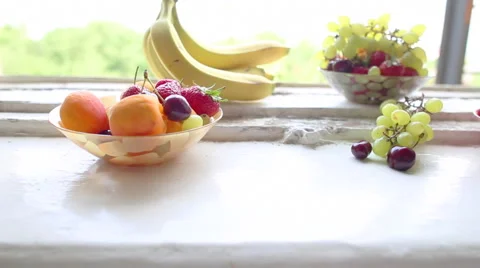 Different Summer fruits on a window sill Stock-Footage 47517299
