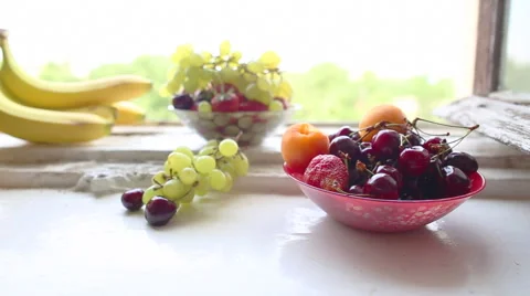 Different Summer fruits on a window sill Stockbeeldmateriaal 52390588
