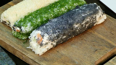 Different sushi rolls on the board Stock-Footage 85424111