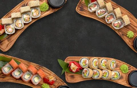 Different sushi rolls on a dark background Stock Photos