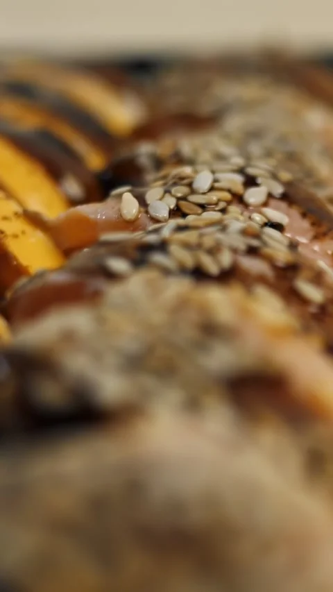 Different sushi rolls rotating close-up on a black background.  Stock Footage 309616124