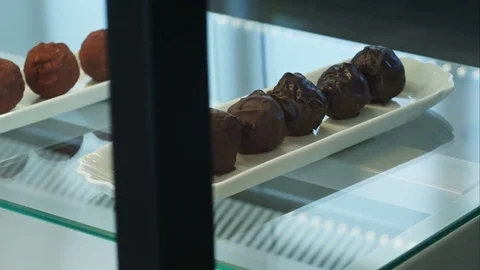 Different sweet candy round chocolate in the shop Vídeos de archivo 77423668