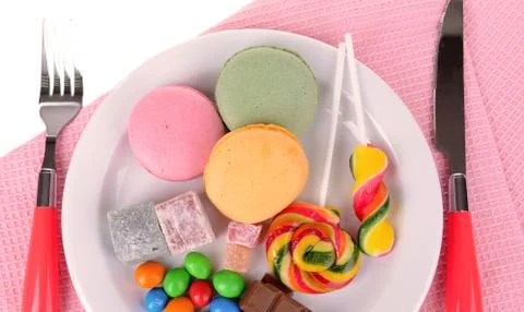 Different sweets on plate on table close-up Stock Photos