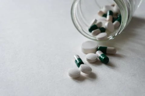 Different tablets and pills at white background Foto stock
