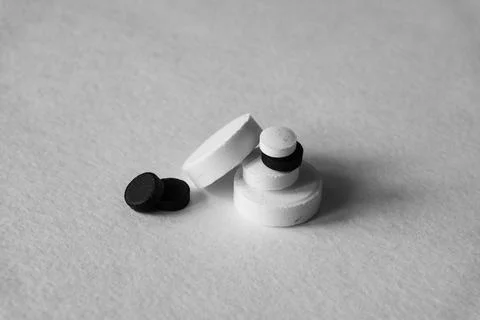 Different tablets and pills at white background Stock Photos