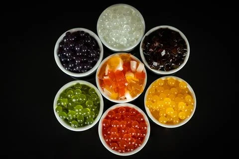 Different tapioca pearls for bubble tea. Bubble tea ingredients arrangement i Stock Photos