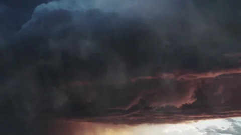 A different thunderstorm appeared in the dark sky as the sun set. Stock Footage 290781983