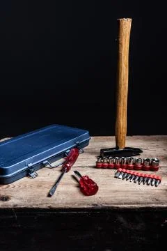Different tools and a blue tool box on a wooden surface Stock Photos