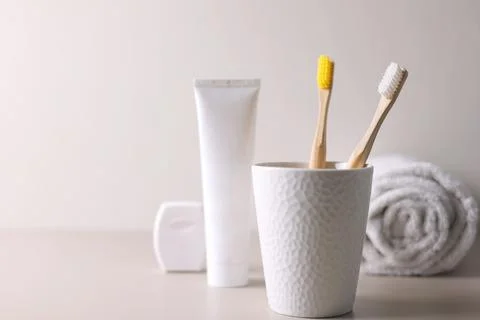 Different toothbrushes on a colored background. Dental care, oral health. Stock Photos
