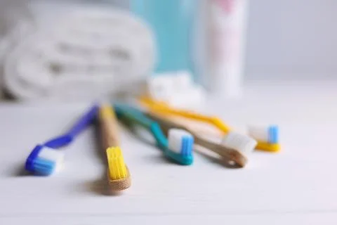 Different toothbrushes on a colored background. Dental care, oral health. Stock Photos