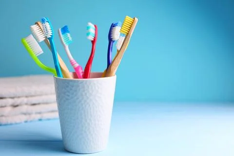 Different toothbrushes on a colored background. Dental care, oral health. Foto stock