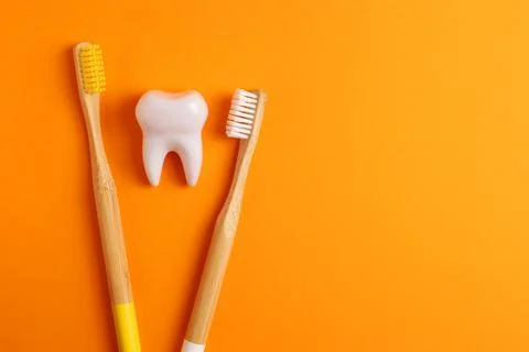 Different toothbrushes on a colored background. Dental care, oral health. Stock Photos
