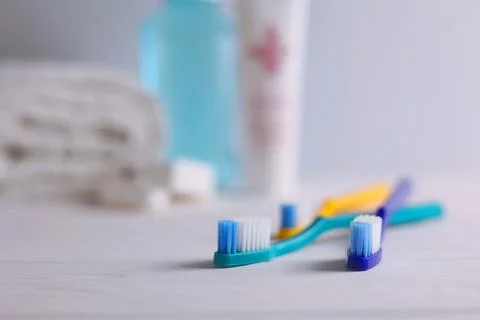 Different toothbrushes on a colored background. Dental care, oral health. Stock Photos