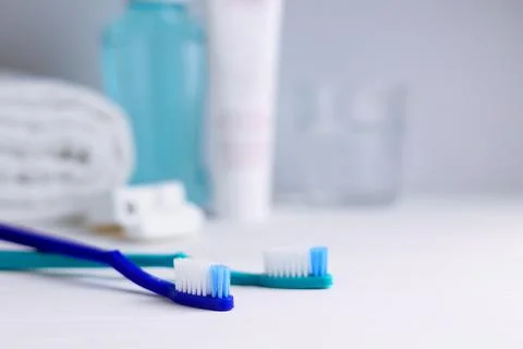 Different toothbrushes on a colored background. Dental care, oral health. Stock Photos