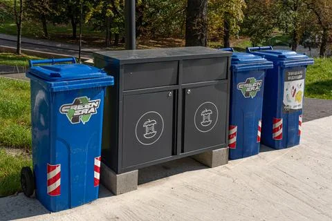 Different trash cans and garbage lockers for recycling in park Stock Photos