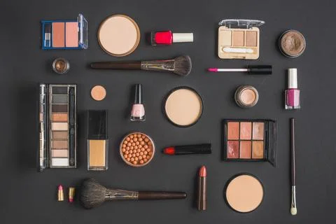 Different type makeup products black backdrop Stock Photos