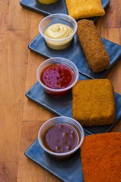 Different type pf simple american fried food on an wooden background. Chicken Stock-Fotos