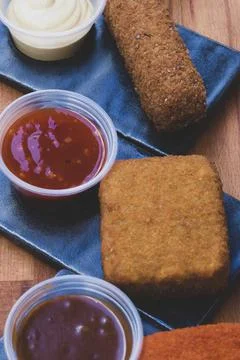 Different type pf simple american fried food on an wooden background. Chicken Foto stock