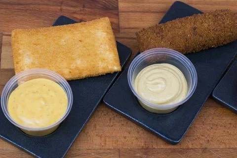 Different type pf simple american fried food on an wooden background. Chicken Stock Photos
