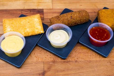 Different type pf simple american fried food on an wooden background. Chicken Foto stock