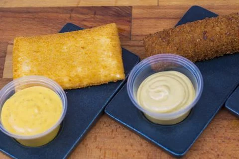 Different type pf simple american fried food on an wooden background. Chicken Stock-Fotos