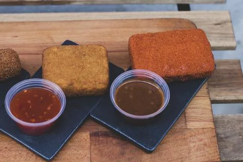Different type pf simple american fried food on an wooden background. Chicken Stock Photos
