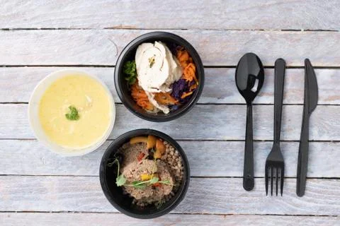 Different Type Of Ready Tasty Meals In Foil Containers On The wooden Table, t Stock Photos