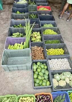 Different type of vegetable in baskets on a street vegetable shop in india Stock Photos