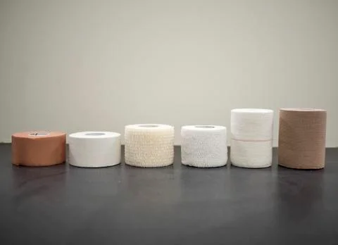 Different types of athletic tape lined up on display Stock Photos