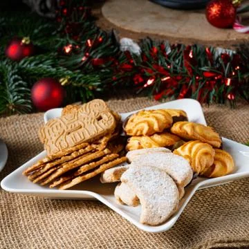 Different types of biscuits with rustic Christmas decorations Stock Photos